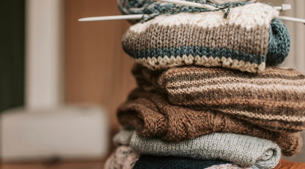 A pile of knitting wips in autumnal shades